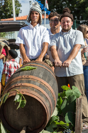 ESTREITO DE CAMARA DE LOBOS, PORTUGAL - SEPTEMBER 10, 2016: People wearing in traditional costumes at Madeira Wine Festival in Estreito de Camara de Lobos, Madeira, Portugal. The Madeira Wine Festival honors the grape harvest with a celebration of traditiのeditorial素材