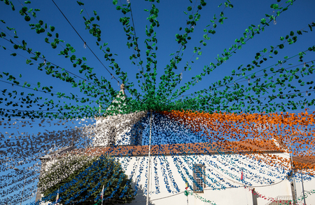 ESTREITO DE CAMARA DE LOBOS, PORTUGAL - SEPTEMBER 10, 2016: Garlands, street decorations at  Madeira Wine Festival in Estreito de Camara de Lobos, Madeira, Portugal. The Madeira Wine Festival honors the grape harvest with a celebration of traditional locaのeditorial素材