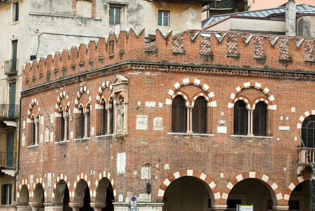 The Domus Mercatorum with crenellations and portico in Verona. Italyの写真素材