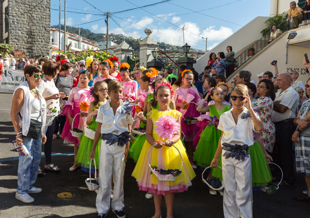 ESTREITO DE CAMARA DE LOBOS, PORTUGAL - SEPTEMBER 10, 2016: Children wearing in traditional costumes at Madeira Wine Festival in Estreito de Camara de Lobos, Madeira, Portugal. The Madeira Wine Festival honors the grape harvest with a celebration of tradiのeditorial素材