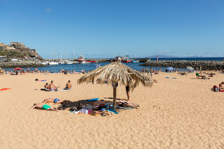 MACHICO, MADEIRA, PORTUGAL - SEPTEMBER 11, 2016: People are resting on a sunny day at the beach in Machico. Madeira Island, Portugaのeditorial素材