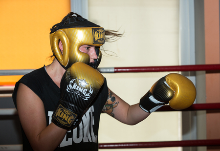 CRACOW, POLAND - FEBRUARY 12, 2016: Agnieszka Niestoj - talented Polish boxer durning boxing training with coach in the gym. Cracow, Polandのeditorial素材