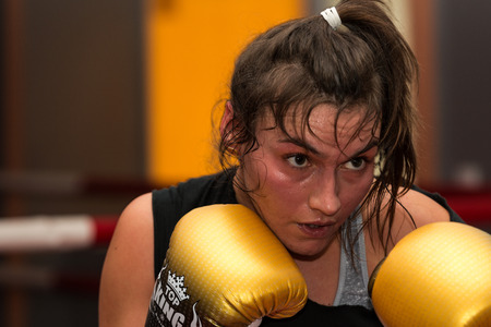 CRACOW, POLAND - FEBRUARY 12, 2016: Agnieszka Niestoj - talented Polish boxer durning boxing training with coach in the gym. Cracow, Polandのeditorial素材