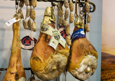 CRACOW, POLAND - NOVEMBER 17, 2016: Italian different traditional sausages and ham at the store in Cracow. Polandのeditorial素材