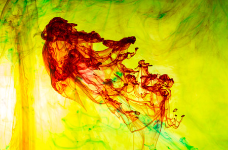 Acrylic colors and ink in water. Abstract background.