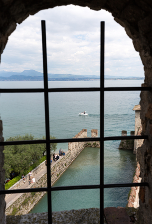 SIRMIONE, ITALY - MAY 5, 2016: Medieval castle Scaliger in old town Sirmione on lake Lago di Garda. Italyのeditorial素材