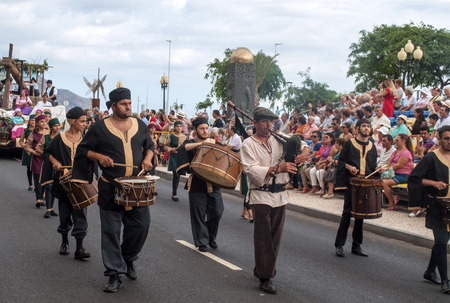 FUNCHAL, PORTUGAL - SEPTEMBER 4, 2016: Group of people in traditional costume  durnig historical and ethnographic  parade of Madeira Wine Festival in Funchal. Madeira, Portugalのeditorial素材