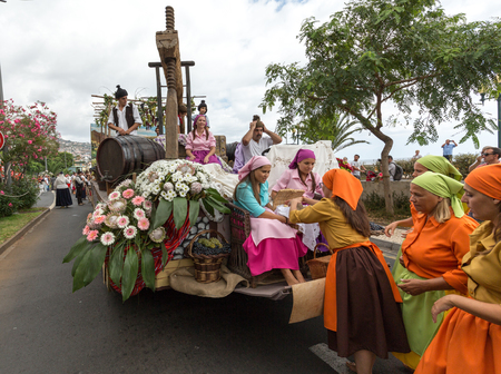 FUNCHAL, PORTUGAL - SEPTEMBER 4, 2016: Group of people in traditional costume  durnig historical and ethnographic  parade of Madeira Wine Festival in Funchal. Madeira, Portugalのeditorial素材