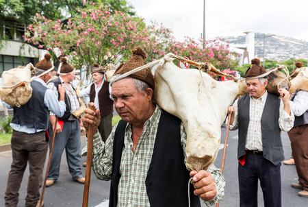 FUNCHAL, PORTUGAL - SEPTEMBER 4, 2016: Group of people in traditional costume  durnig historical and...
