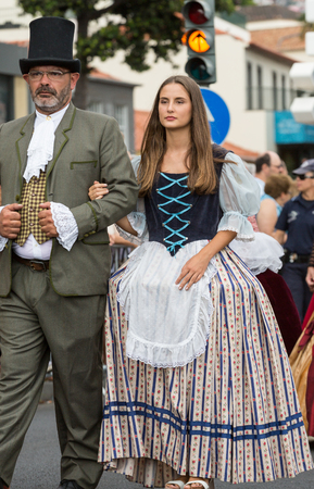 FUNCHAL, MADEIRA, PORTUGAL - SEPTEMBER 4, 2016:  Couple in historical fashion dress durnig historical and ethnographic  parade of Madeira Wine Festival in Funchal. Madeira, Portugalのeditorial素材