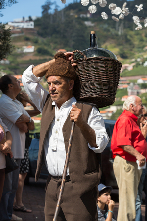 ESTREITO DE CAMARA DE LOBOS, PORTUGAL - SEPTEMBER 10, 2016: People wearing in traditional costumes at Madeira Wine Festival in Estreito de Camara de Lobos, Madeira, Portugal.のeditorial素材