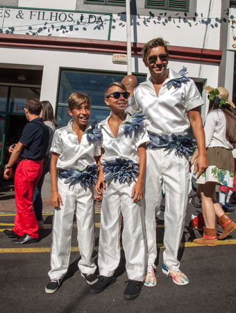 ESTREITO DE CAMARA DE LOBOS, PORTUGAL - SEPTEMBER 10, 2016: People wearing in traditional costumes at Madeira Wine Festival in Estreito de Camara de Lobos, Madeira, Portugal.のeditorial素材
