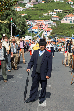 ESTREITO DE CAMARA DE LOBOS, PORTUGAL - SEPTEMBER 10, 2016: People wearing in traditional costumes at Madeira Wine Festival in Estreito de Camara de Lobos, Madeira, Portugal.のeditorial素材