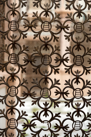 Old window covered with a metal grate in Italyのeditorial素材