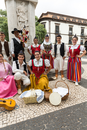 FUNCHAL, PORTUGAL - SEPTEMBER 2, 2016: Dancers with local costumes demonstrating a folk dance during the Wine Festival in Funchal on the Madeira, Portugal.のeditorial素材