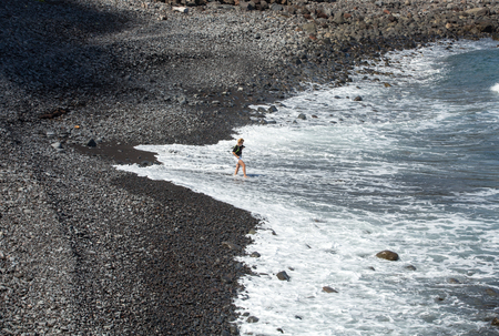 MADEIRA, PORTUGAL - SEPTEMBER 9, 2016: Beach of black stones on the island of Madeira, Portugalのeditorial素材