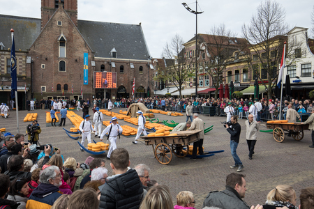 ALKMAAR, THE NETHERLANDS - APRIL 21, 2017: Typical cheese market in the city of Alkmaar in Netherlands, one of the only four traditional Dutch cheese markets still in existence and one of the country's most popular tourist attractions. のeditorial素材