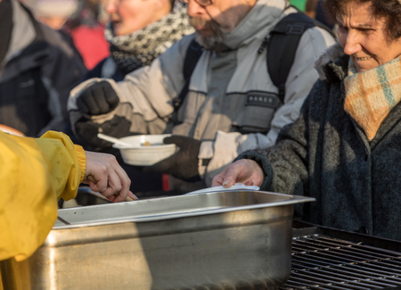 Cracow, Poland - december 17, 2017:   Christmas Eve for poor and homeless on the Main Square in...