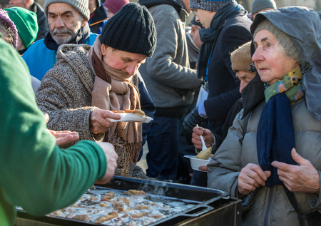 Cracow, Poland - December 17, 2017:   Christmas Eve for poor and homeless on the Main Square in Cracow. Every year the group Kosciuszko prepares the greatest eve in the open air in Cracow. Polandのeditorial素材