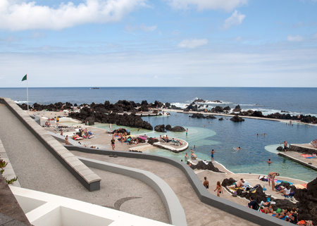PORTO MONIZ, MADEIRA, PORTUGAL - SEPTEMBER 5, 2016: Natural rock pool of Porto Moniz. It is a public bath with water from the Atlantic Ocean.のeditorial素材