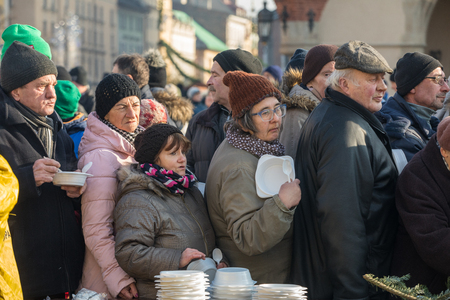 Cracow, Poland - December 17, 2017:   Christmas Eve for poor and homeless on the Main Square in Cracow. Every year the group Kosciuszko prepares the greatest eve in the open air in Cracow. Polandのeditorial素材
