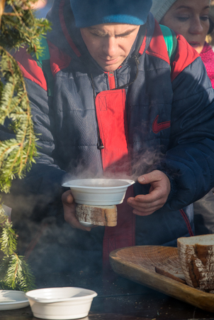 Cracow, Poland - December 17, 2017:   Christmas Eve for poor and homeless on the Main Square in Cracow. Every year the group Kosciuszko prepares the greatest eve in the open air in Cracow. Polandのeditorial素材