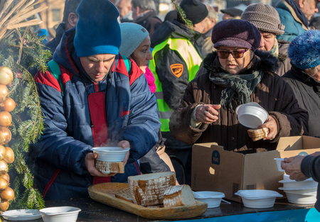 Cracow, Poland - December 17, 2017:   Christmas Eve for poor and homeless on the Main Square in Cracow. Every year the group Kosciuszko prepares the greatest eve in the open air in Cracow. Polandのeditorial素材