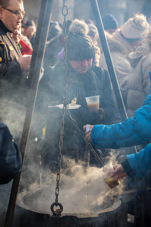 Cracow, Poland - December 17, 2017:   Christmas Eve for poor and homeless on the Main Square in Cracow. Every year the group Kosciuszko prepares the greatest eve in the open air in Cracow. Polandのeditorial素材