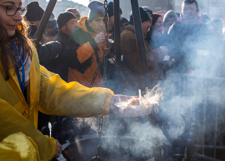 Cracow, Poland - December 17, 2017:   Christmas Eve for poor and homeless on the Main Square in Cracow. Every year the group Kosciuszko prepares the greatest eve in the open air in Cracow. Polandのeditorial素材