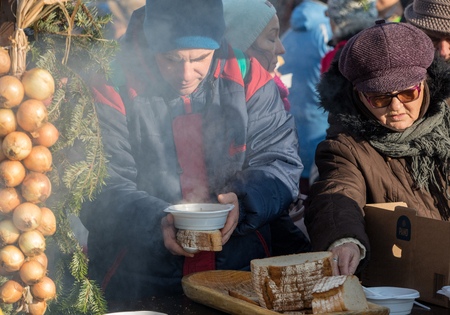 Cracow, Poland - December 17, 2017:   Christmas Eve for poor and homeless on the Main Square in Cracow. Every year the group Kosciuszko prepares the greatest eve in the open air in Cracow. Polandのeditorial素材