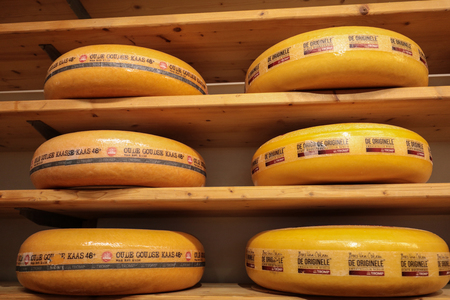 ALKMAAR, NETHERLANDS - APRIL 21, 2017: Display of traditional Dutch cheese, like Edam and Gouda cheese  at local cheese shop, Alkmaar, the Netherlandsのeditorial素材
