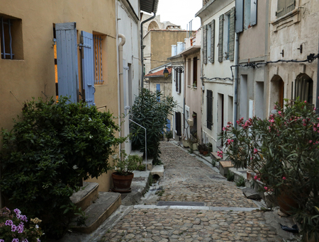 Steps and narrow street in the old town of Arles in Provence in the South of France.の写真素材