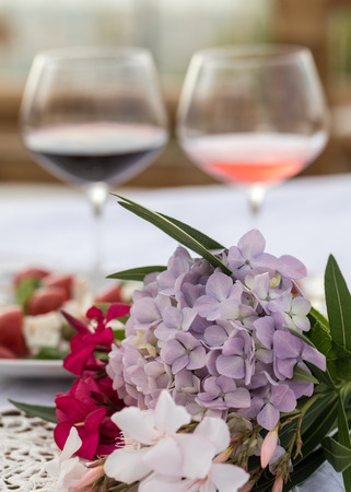 Table on the terrace prepared for a romantic dinnerの写真素材