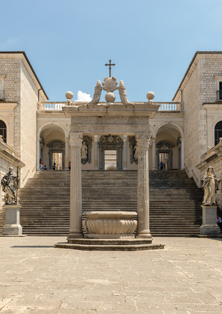 Monte Cassino, Italy - June 17, 2017: Cistern and statues of St. Benedict and St. Scholastica in the Cloister of Bramante, Benedictine abbey of Monte Cassino. Italyのeditorial素材