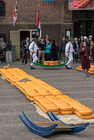 ALKMAAR, THE NETHERLANDS - APRIL 21, 2017: Typical cheese market in the city of Alkmaar in Netherlands, one of the only four traditional Dutch cheese markets still in existence and one of the country's most popular tourist attractions. のeditorial素材