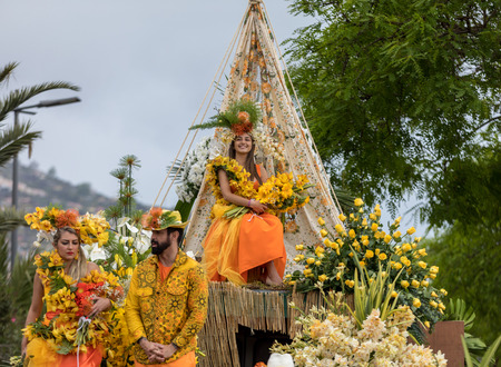Funchal, Madeira, Portugal - April 22, 2018 : A group of people in colorful costumes on the floral...