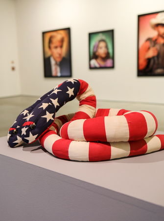 Cracow, Poland - May 8, 2018: Exibition Motherland in Art at Mocak in Krakow. Melissa Vanderberg - Polycephalic Patriot. Two-headed plush snake, made from pieces of flags is a criticism of a two party politicial systemのeditorial素材