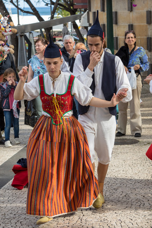 Funchal, Portugal - April 19, 2018:  Folk musicians and dancers performing on the Avenida Arriaga  in Funchal on the Madeira Island, Portugal.のeditorial素材