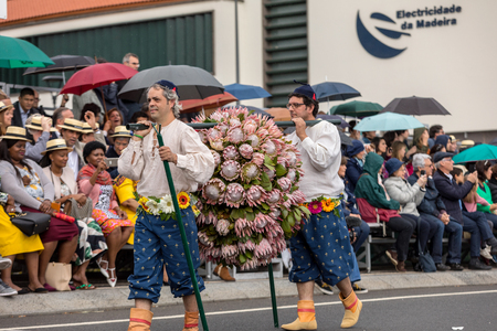 Funchal; Madeira; Portugal - April 22; 2018: Annual parade of the Madeira Flower Festival in the city of Funchal on the Island of Madeira. Portugal.のeditorial素材