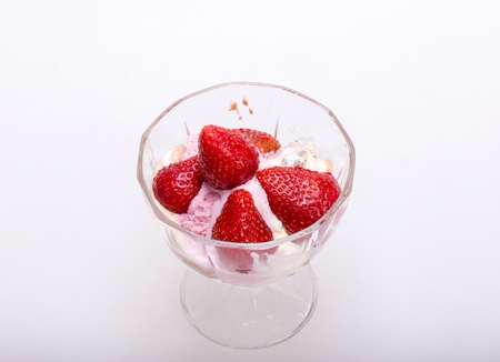 ice cream and fresh ripe strawberries  isolated on white backgroundの写真素材