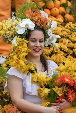 Funchal; Madeira; Portugal - April 22; 2018: Woman on the floral float at Madeira Flower Festival Parade in Funchal on the Island of Madeira. Portugal.のeditorial素材