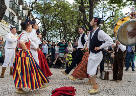 Funchal, Portugal - April 19, 2018:  Folk musicians and dancers performing on the Avenida Arriaga  in Funchal on the Madeira Island, Portugal.のeditorial素材