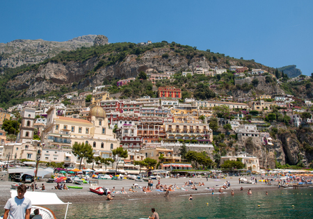 Positano, Italy - June 13, 2017: People are resting on a sunny day at the beach in Positano on Amalfi Coast in the region Campania, Italyのeditorial素材