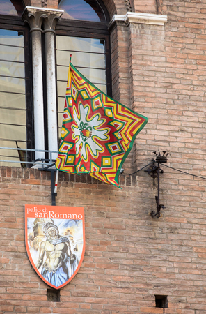 Ferrara, Italy - June 10, 2017: Palio flags and badges. The Palio of St. George is a typical medieval festival. Detail of Palio shield decoration. Palazzo Municipale (Town Hall) in  Ferrara Emilia-Romagna Italyのeditorial素材