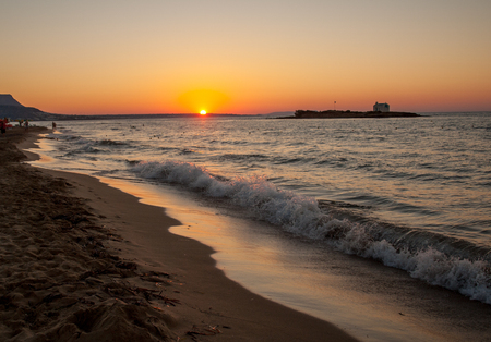 Sunset over Malia on Crete island in Greeceの写真素材