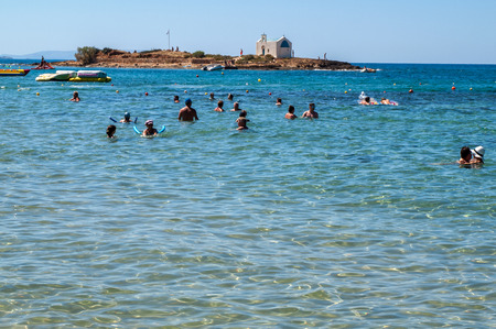 Malia. Crete, Greece - July 1, 2018: People are resting on a sunny day at the beach in Malia, Crete, Greeceのeditorial素材