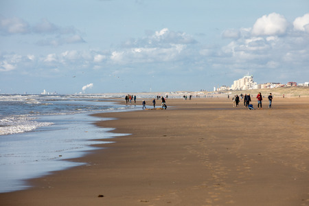 Katwijk, Netherlands - April 23, 2017: People are walking on a sunny day along the beach in Katwijk. Netherlandsのeditorial素材