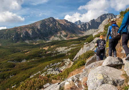Vysoke Tatry, Slovakia - October 9, 2018: Hikers on trail at Great Cold Valley,  Vysoke Tatry (High Tatras), Slovakia. The Great Cold Valley is 7 km long valley, very attractive for touristsのeditorial素材