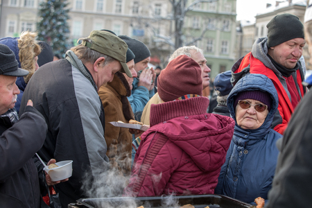 Cracow, Poland - December 16, 2018: Christmas Eve for poor and homeless on the Main Square in Cracow. Every year the group Kosciuszko prepares the greatest eve in the open air in Cracow. Polandのeditorial素材