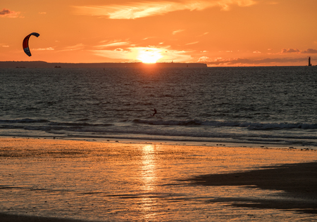 Saint-Malo, France - September 13, 2018: Sunset and Kitesurfers on the beach in Saint Malo,  Brittany, Franceのeditorial素材